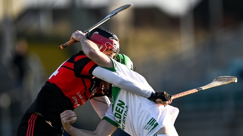Ballyhale Shamrocks' Joey Holden of gets in a tangle with with Jon Nolan of Mount Leinster Rangers