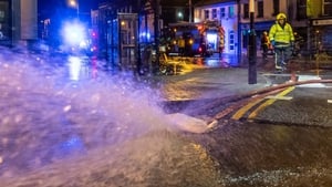 Members of the fire brigade pump away floodwater in Bantry