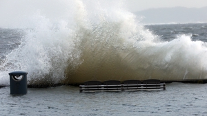 Waves hit the seafront in Howth, Dublin