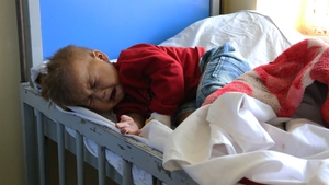 A child cries in the malnutrition department of Indira Gandhi Children's Hospital in Kabul, Afghanistan