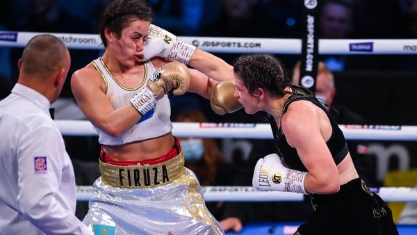 Katie Taylor (R) lands a punch on Firuza Sharipova