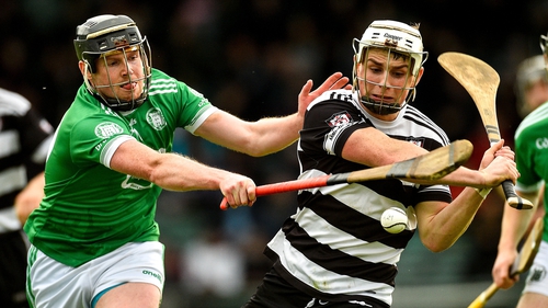 Tommy O'Connell of Midleton in action against Micheal Houlihan of Kilmallock