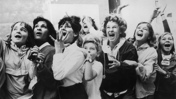 Women and girls in Toronto, Canada screaming with joy during a visit by the Beatles to their city. (Photo by Fox Photos/Getty Images)