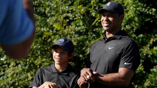 Tiger Woods and his son Charlie pose for photos during the PNC Championship at the Ritz-Carlton Golf Club