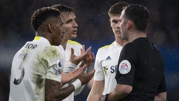 Junior Firpo, Diego Llorente and Jamie Shackleton protest to referee Andy Madley at Stamford Bridge