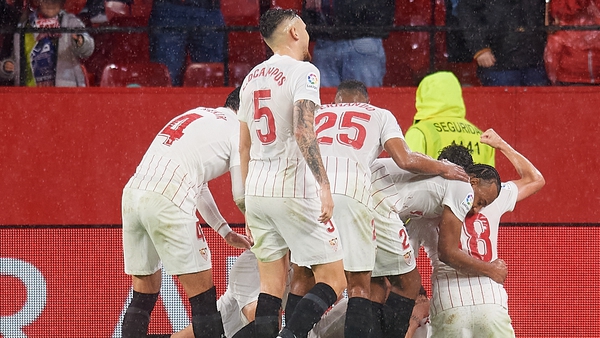 Sevilla players celebrate Papu Gomez's goal