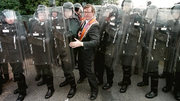 UUP leader David Trimble squeezes through an RUC line at Drumcree in 1996