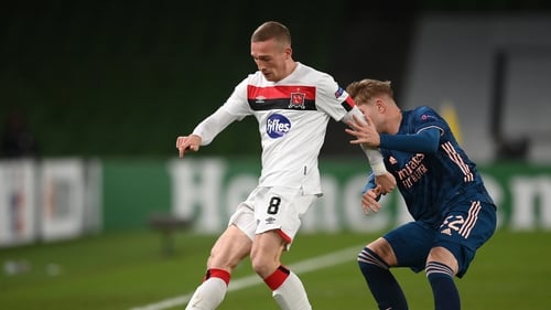 John Mountney of Dundalk in action against Emile Smith-Rowe of Arsenal in 2020