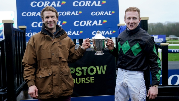 Winning trainer Sam Thomas (left) and jockey Stan Sheppard celebrate with the trophy after winning the Coral Welsh Grand National Handicap Chase with Iwilldoit