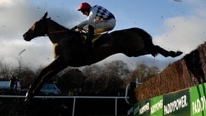 Galvin, with Davy Russell up, jumps the last on their way to winning the Savills Steeplechase
