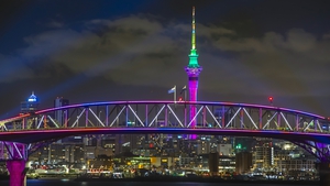 A light show from the Skytower and harbour bridge as Auckland, New Zealand welcomes in 2022