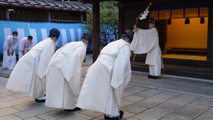 Musicians receive purification before attending a ritual preparing for the New Year at Meiji Shrine in Tokyo, Japan