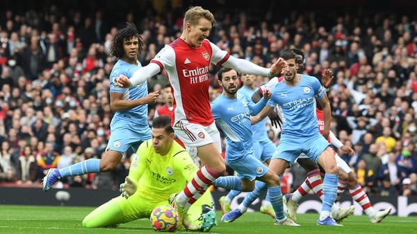 Arsenal's Martin Odegaard is challenged by Man City goalkeeper Ederson. VAR had ruled that referee Stuart Attwell was correct not to award the Gunners a spot-kick