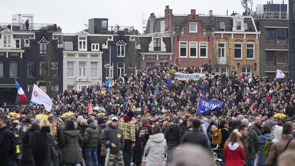 People gather in Amsterdam to protest over current Covid restrictions
