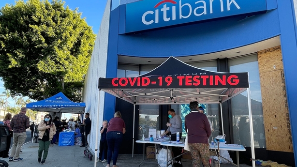 People register for a free test in front of a City Bank in Los Angeles