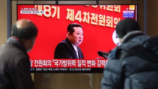People watch a television broadcast reporting on North Korea's Kim Jong-un at Seoul Railway Station