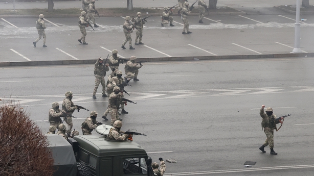 Several armoured personnel carriers and dozens of troops on foot entered the main square of Almaty