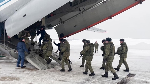 Russian servicemen boarding a military aircraft on their way to Kazakhstan, at an airfield outside Moscow today