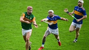 Kerry's Fionan MacKessy evades the clutches of Tipperary's Ger Browne