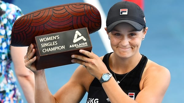 The Australian holds the Women's Singles Champion trophy after the Adelaide International final