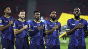 Roberto Lopes (second left) lines up for the national anthem at Stade d'Olembe.