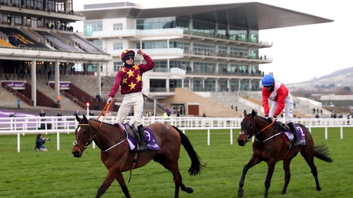 Jack Kennedy celebrates winning the 2021 Cheltenham Gold Cup on Minella Indo ahead of A Plus Tard and Rachael Blackmore