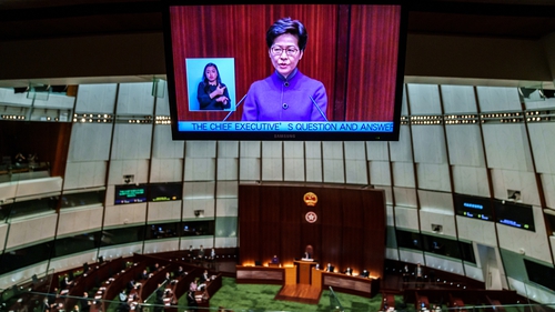 Carrie Lam seen on a screen in the chamber of the Legislative Council