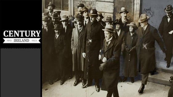 Century Ireland Issue 222 - Michael Collins, marked with an X, leaving Dublin Castle in 1922. Ahead of him is Kevin O'Higgins and behind him is Eamonn Duggan Photo: National Library of Ireland, NPA CIVP4