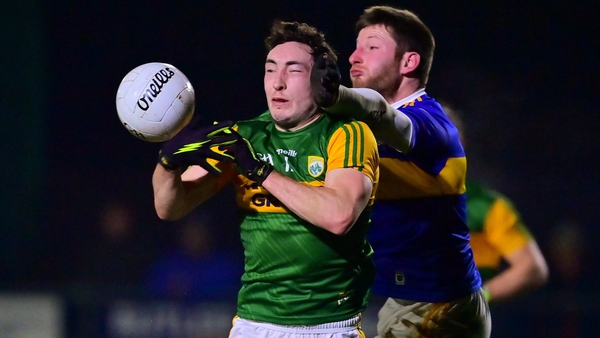 Paudie Clifford of Kerry is tackled by Jimmy Feehan