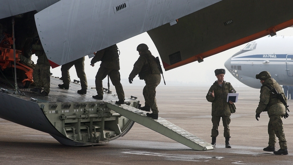 Russian servicemen board a homebound flight at Almaty International Airport