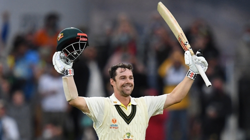 Travis Head salutes the crowd in Tasmania after his first innings century