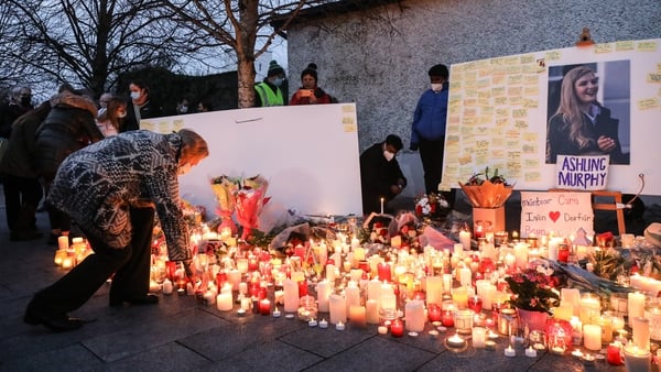 Local people light candles after a vigil for Ashling Murphy in Tullamore in the aftermath of her murder