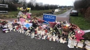Flowers left in tribute to and remembrance of the late Ashling Murphy near the site of her murder in Tullamore