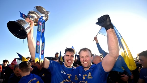 Captain Ian Maguire, left, and team-mate Michael Shields celebrate with the cup