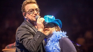 Bono and Javier Bardem on stage in Barcelona in 2015