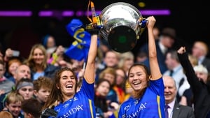 Tipperary's Elaine Fitzpatrick, left, and Niamh Martin lift the Mary Quinn Memorial Cup after beating Meath in 2019