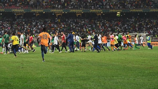 Fans flood onto pitch after Ivory Coast's win over Algeria in Douala