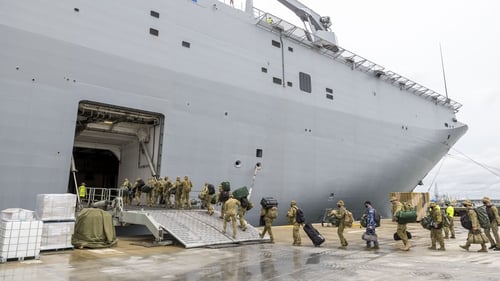 Australian Defence Force members board the HMAS Adelaide en route to Tonga last week