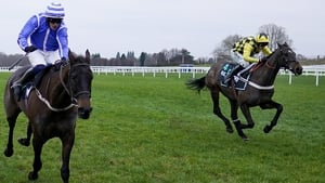 Nico de Boinville aboard Shishkin (R, yellow) gets up on the run-in to win the SBK Clarence House Chase.