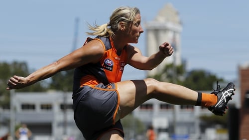 Cora Staunton of the Giants kicks the ball during the defeat to North Melbourne