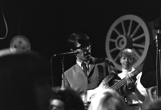 Irish artist Robert Ballagh singing and playing bass guitar with the showband group The Chessmen, on 'The Showband Show' in 1965.