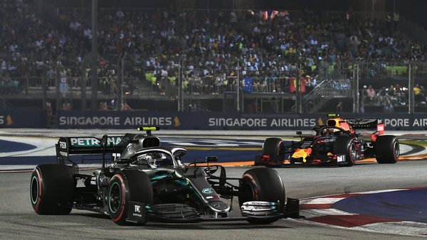 Mercedes' Valtteri Bottas (L) Red Bull's Max Verstappen in action at the Singapore Grand Prix in 2019.