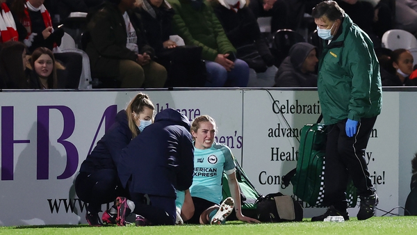 Megan Connolly receives treatment on the sideline