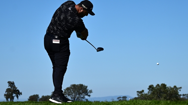 Jon Rahm hits his tee shot on the second hole during the second round of The Farmers Insurance Open