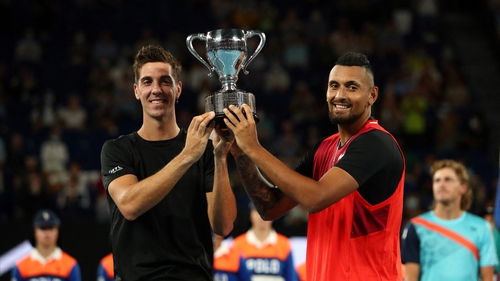 Thanasi Kokkinakis (L) and compatriot Nick Kyrgios pose with the trophy