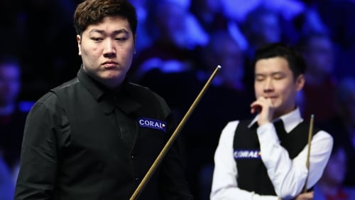 Yan Bingtao (left) faces Zhao Xintong in Sunday's final