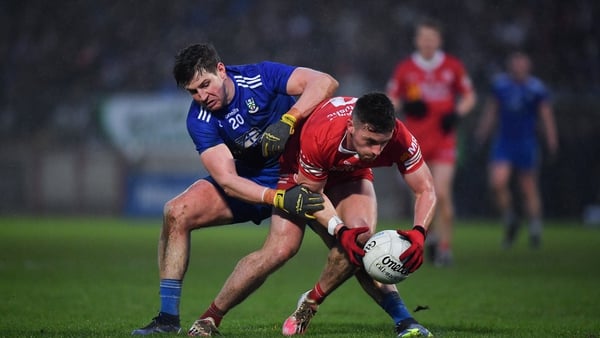 Tyrone's Liam Rafferty and Monaghan's Darren Hughes battle for possession at Healy Park