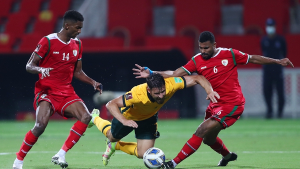 Australia's Mathew Leckie is brought down against Oman in their 2-2 draw