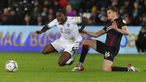 Michael Obafemi fouled in a challenge by Reece Burke of Luton Town
