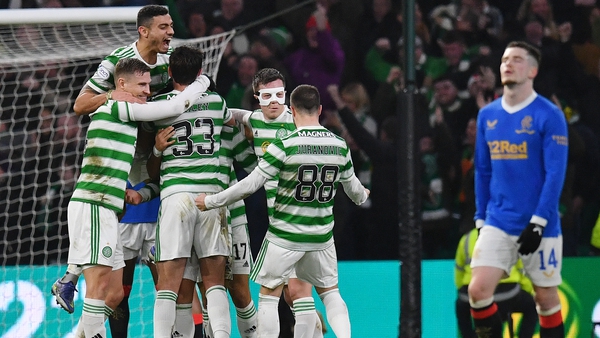 Celtic's Reo Hatate celebrates with his team-mates after his second goal against Rangers